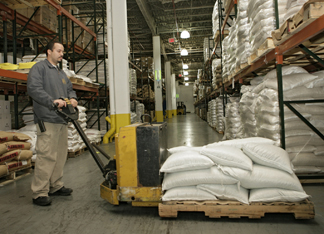 View of a worker moving goods on a pallet.