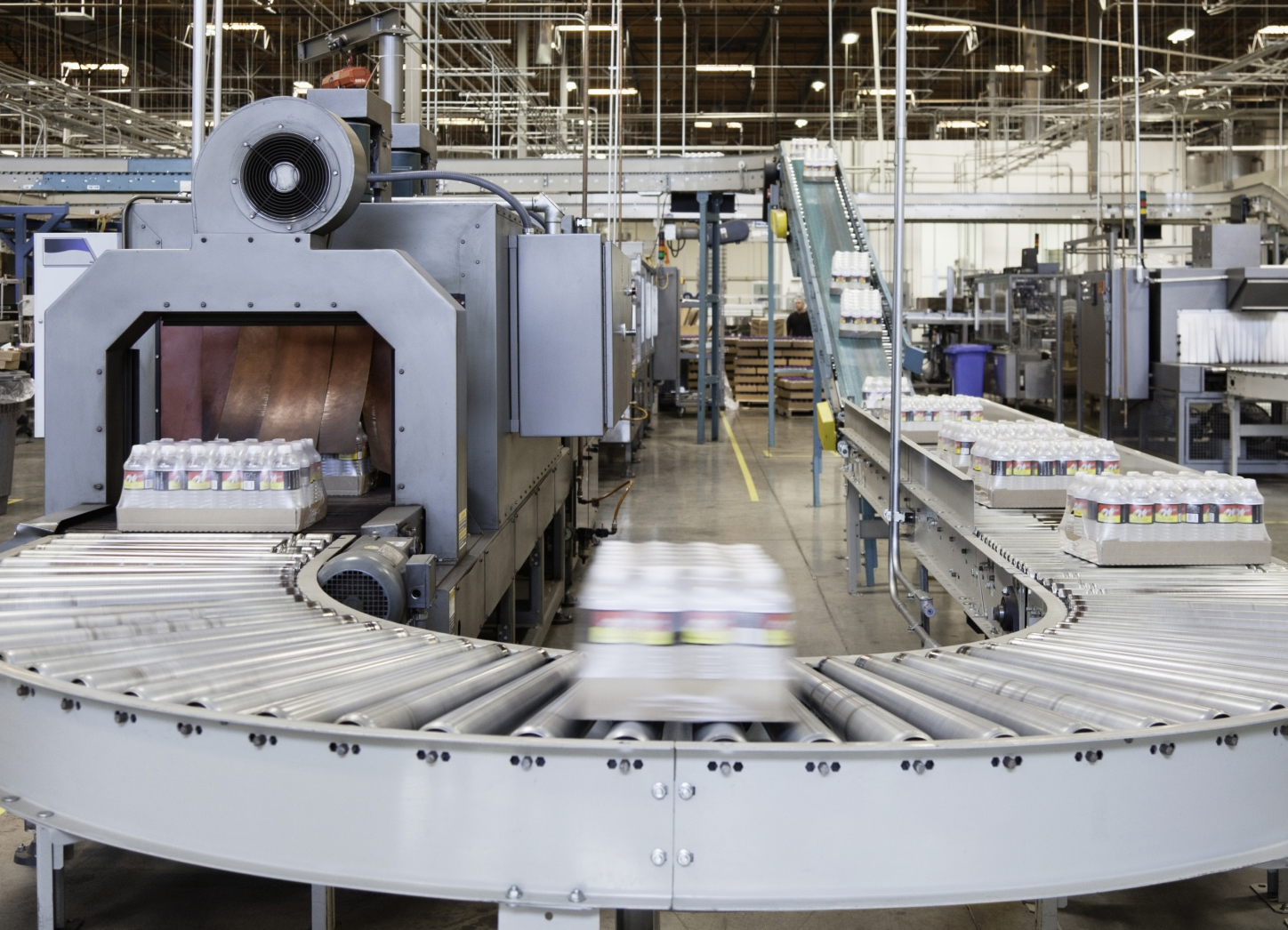 Packed bottle moving on conveyor belt